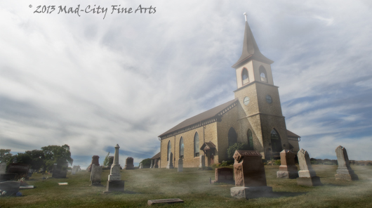 A historic Norwegian church is shrouded by mist in rural Dane County, WI near Madison.